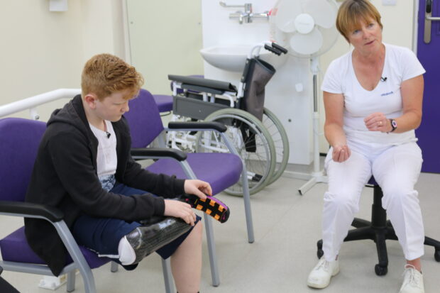 Ben speaking to sports prosthetist, Clare Johnson about his new sports prosthesis.